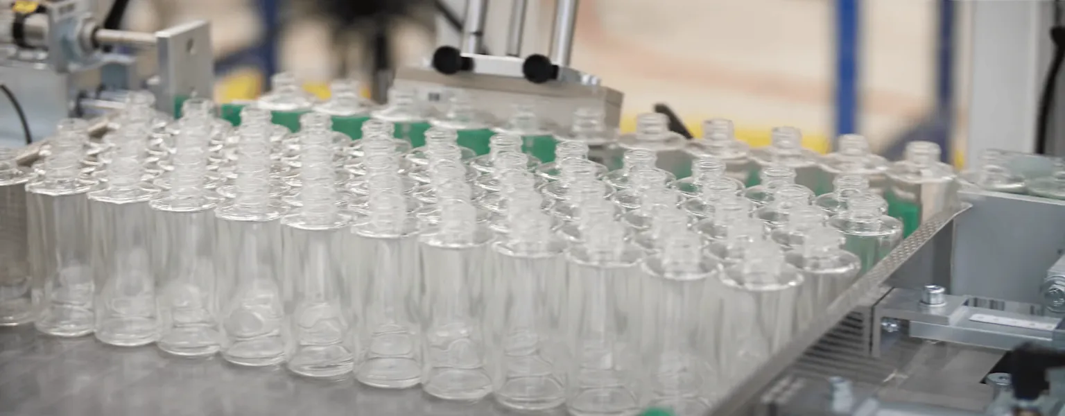 Hugo Beck - Glass bottles grouped and shrink-wrapped
