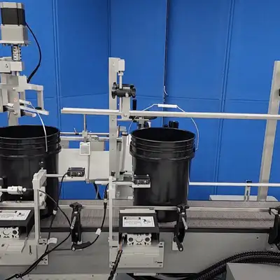 Universal Labeling Systems automatic 5 gallon bucket labeling