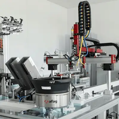 Afag provision of inserts for a plastic injection molding machine